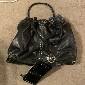 Black leather Michael Kors handbag and wallet with silver rivets